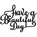 Black iron wall sign with script text "Have a Beautiful Day"