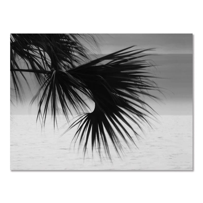 Black-and-white wall poster with close-up palm fronds over ocean horizon