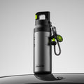 Black sports water bottle with quick-open handle and dangling keychain, 580 ml
