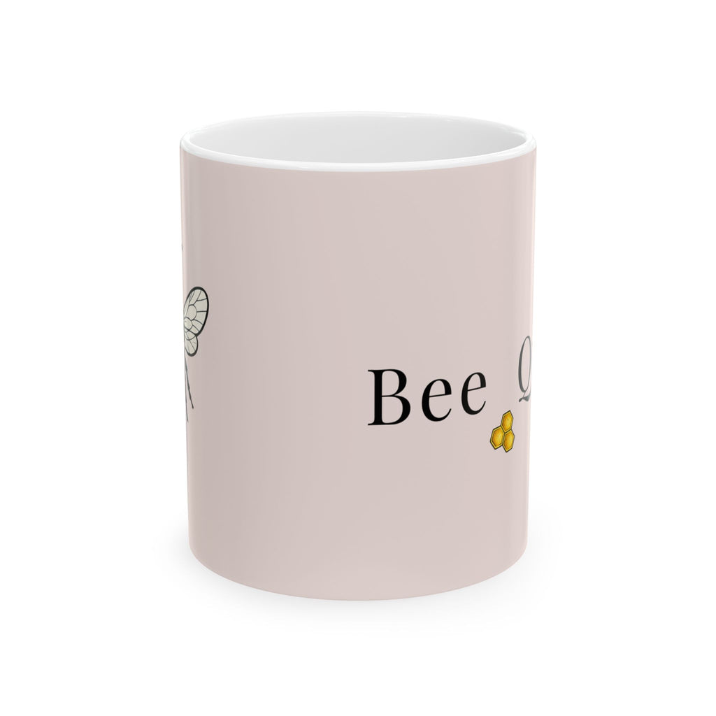 Pink ceramic mug with 'Bee' lettering and small bee illustration