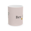 Pink ceramic mug with 'Bee' lettering and small bee illustration