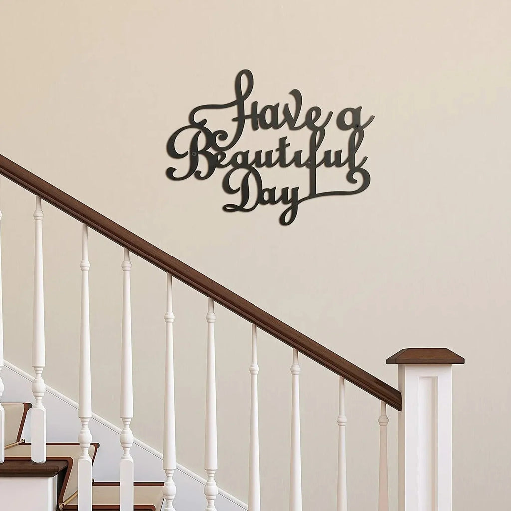 Black iron wall sign reading "Have a Beautiful Day"