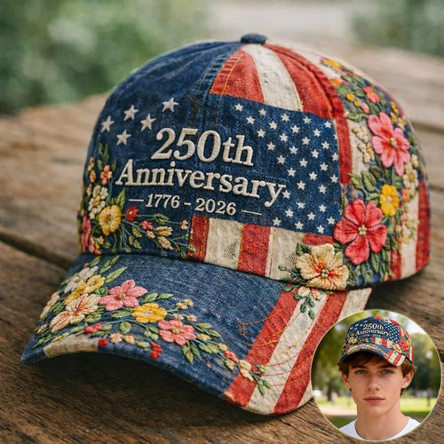 Baseball cap with blue and striped panels, “250th Anniversary 1776–2026” and rose embroidery
