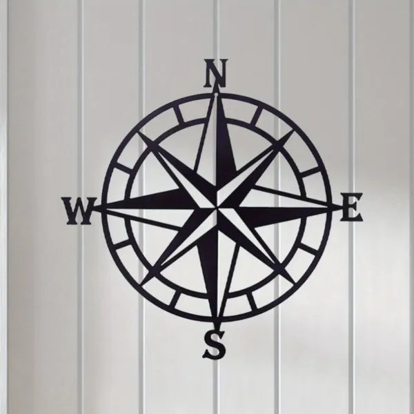 Compass rose metal wall art with black circular ring, eight spokes, and N, E, S, W labels