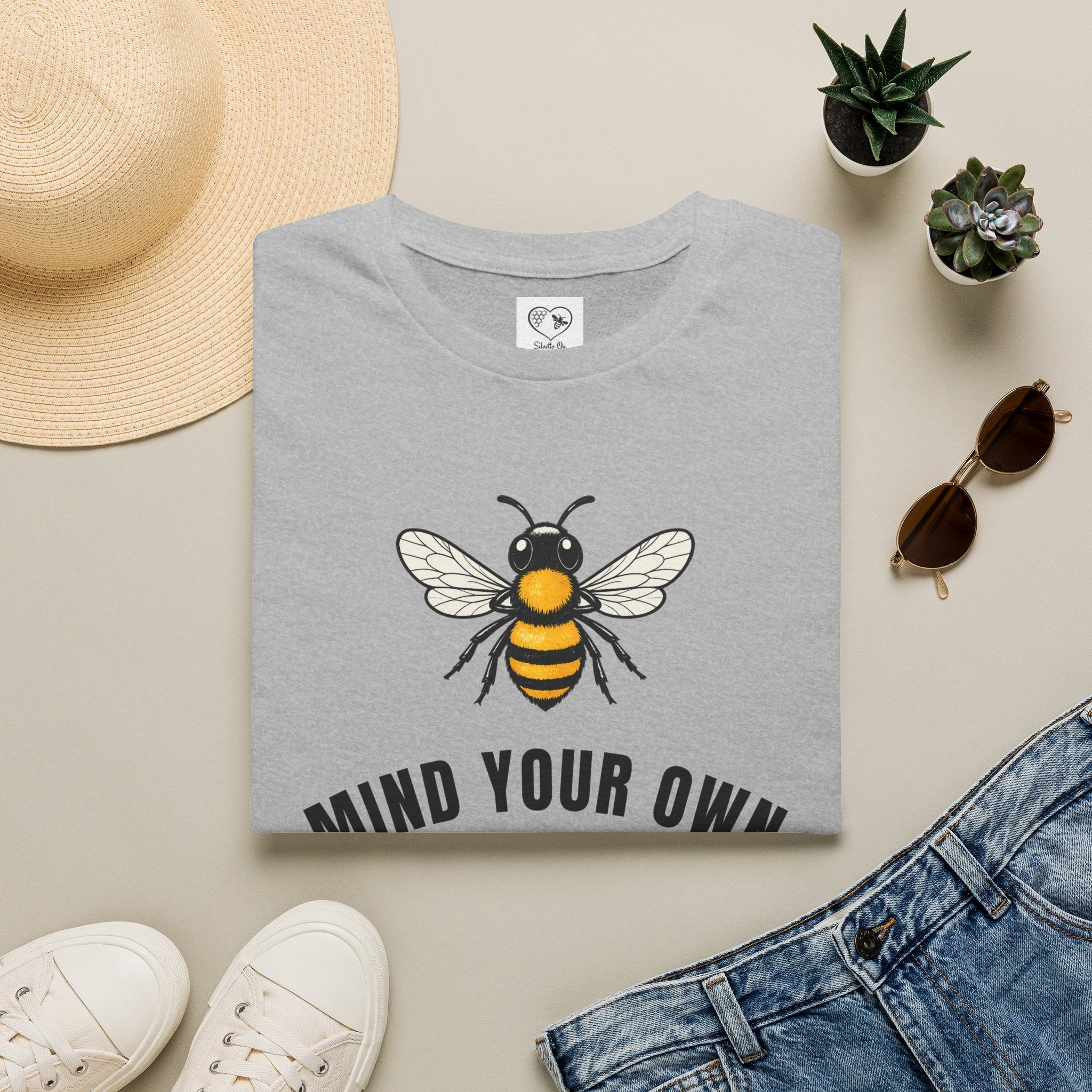 Sport grey t-shirt with bee illustration and bold "MIND YOUR OWN" text on front