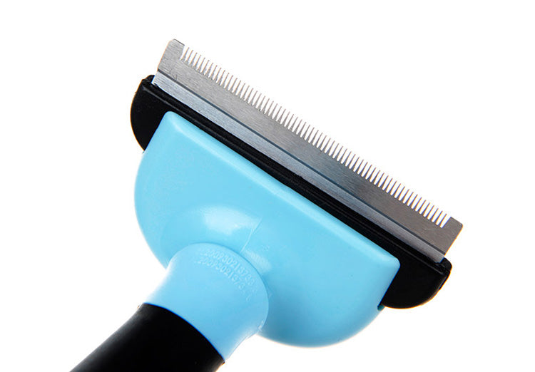 Close-up of blue pet grooming deshedding comb head with metal teeth and guard.