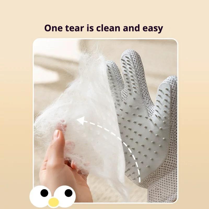 Gray pet grooming glove on hand removing loose white fur with silicone bristles