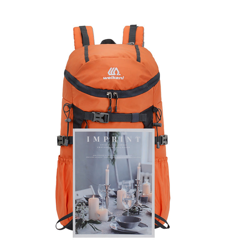 Orange hiking backpack with front zipper pocket and adjustable harness straps