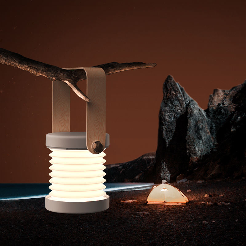 Foldable LED night lantern with white ridged body and warm light, open handle