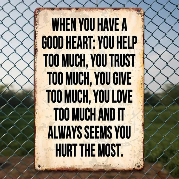 Distressed vintage metal sign with motivational quote text in bold black lettering