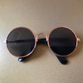 Round sunglasses for pets with black lenses and gold-tone frames