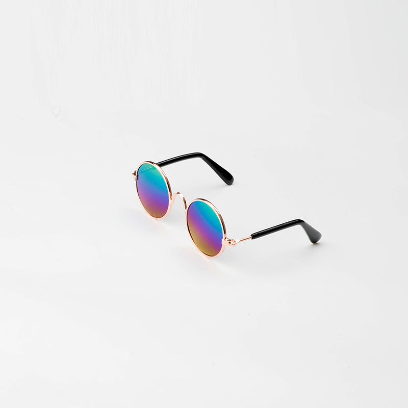 Round pet sunglasses with black arms, multicolor tinted lenses, and rose-gold frame