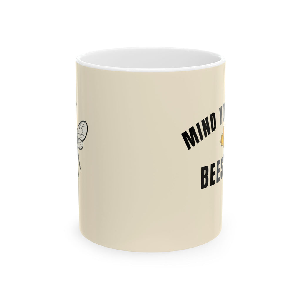 Beeswax ceramic mug, light cream with black “MIND YOUR OWN BEESWAX” text