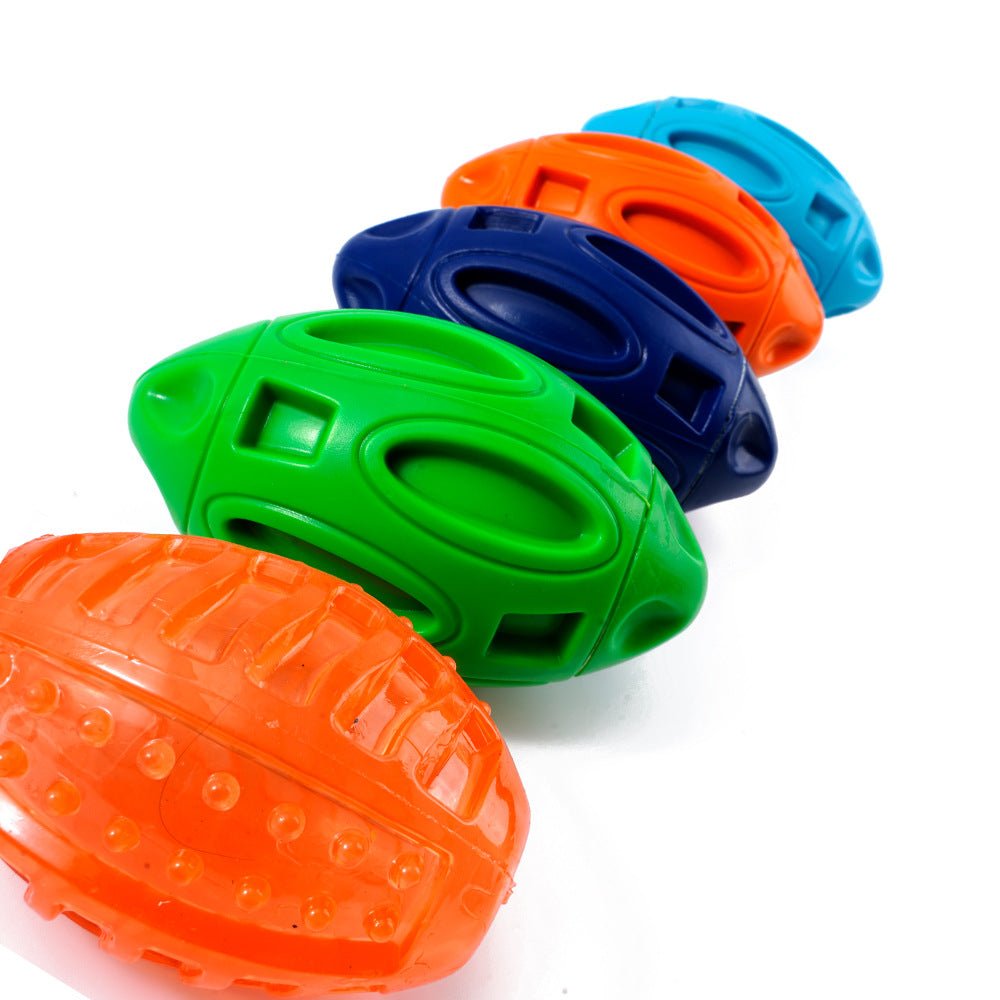 Squeaky rubber rugby dog toy balls in green, orange, and blue with textured grips