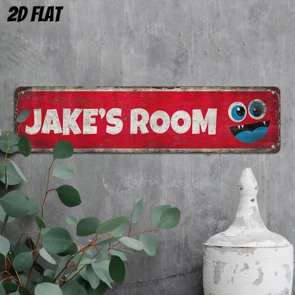 Aluminum decorative sign with “JAKE'S ROOM” lettering and blue owl eyes