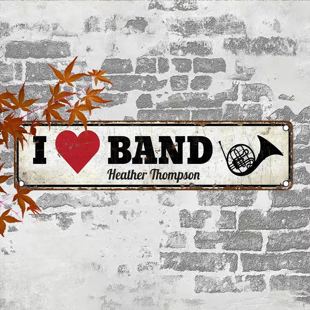 Weathered vintage aluminum wall sign reading 'I ♥ BAND' and 'Heather Thompson'