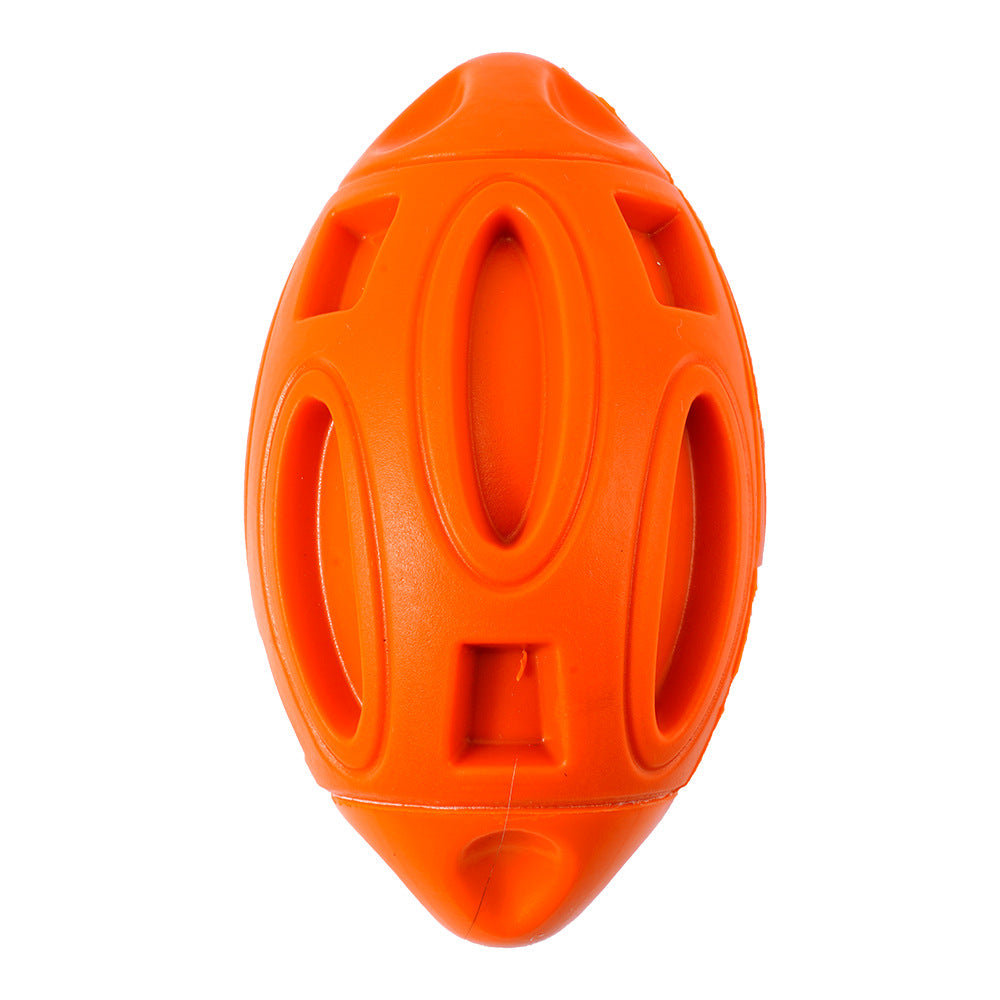 Orange squeaky rubber rugby dog toy ball with oval grip openings
