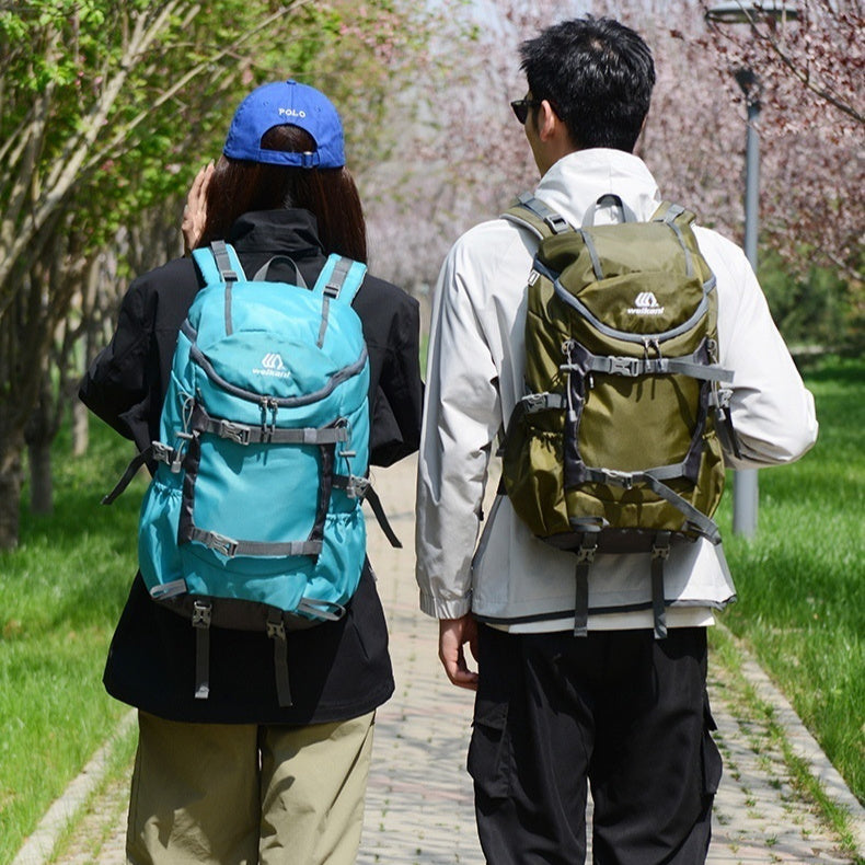 Teal hiking backpack with front pockets and adjustable shoulder straps