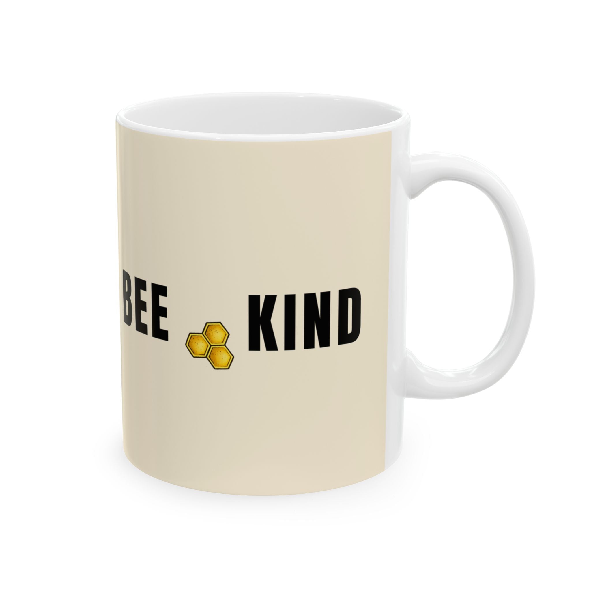 Cream ceramic mug with BEE KIND text and honeycomb icon