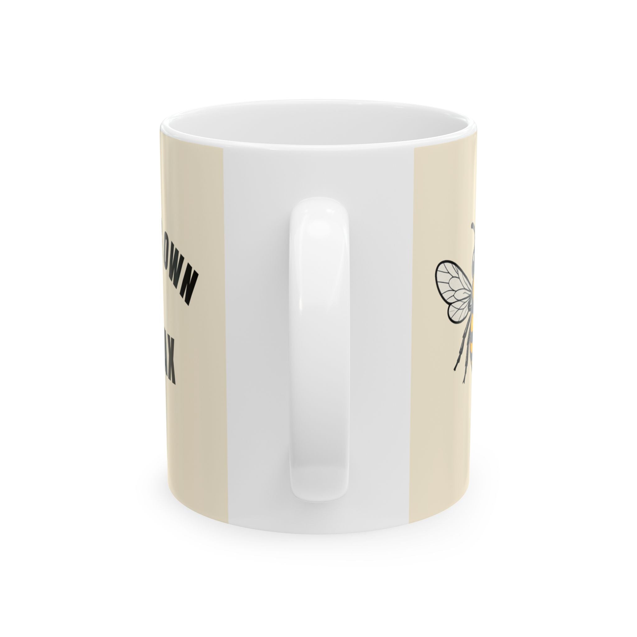 Light cream ceramic mug with white interior, partial black text and bee line art