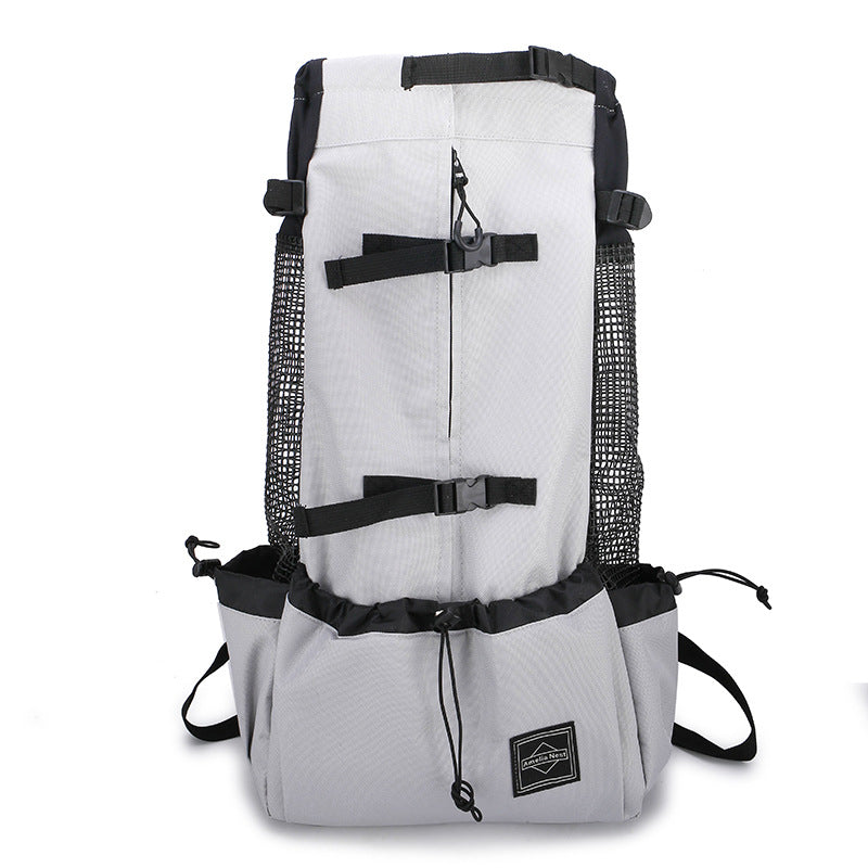 White pet carrier backpack with black straps, zip front, mesh side panels, and buckles