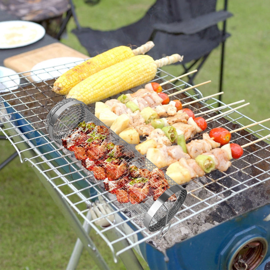 Two round stainless-steel grill baskets with wire mesh, holding corn and diced meat/veg