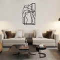 Female silhouette iron wall art with a line drawing of a woman holding a vertical panel