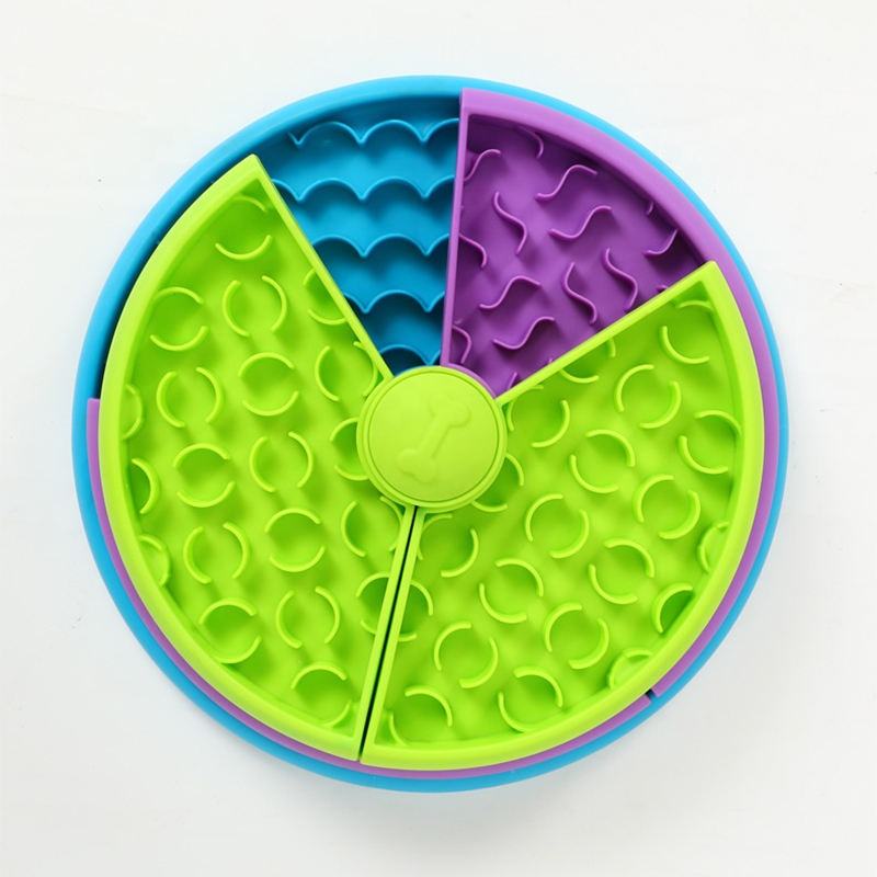 Green rotating slow feeder puzzle bowl with purple and blue divided tiers