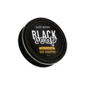 Black soap bar in round container, grey coverage bar shampoo label