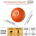 Orange gravitational jump ball toy, textured shell with size guide
