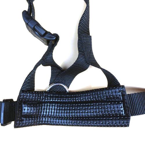 Black nylon dog muzzle with padded strap and metal ring, adjustable fit