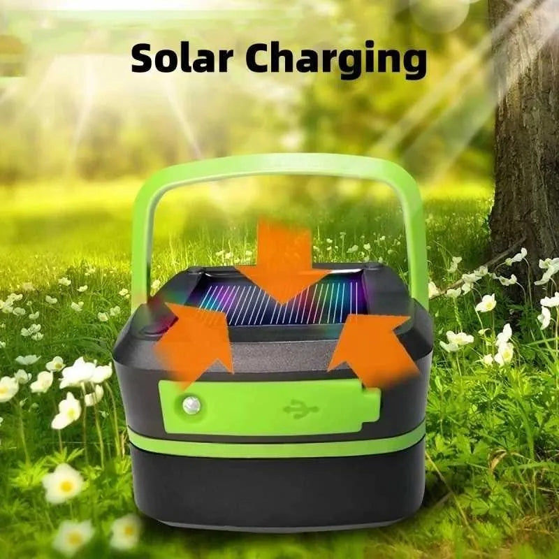 Green and black solar camping lantern with solar panel on top and glowing diffuser