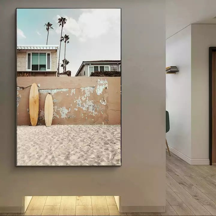 Surfer wall canvas print with beige stucco wall, palm silhouettes, and three surfboards