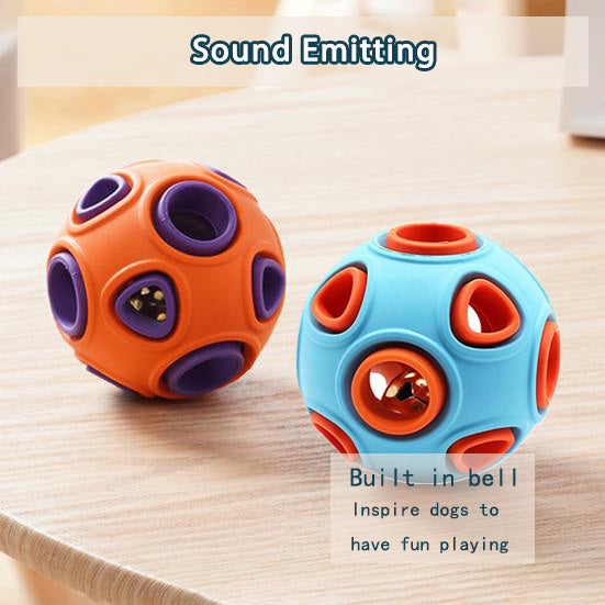Orange and blue rubber bell toy balls on a wooden surface with molded openings