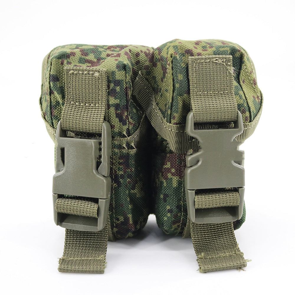 Multi-functional bag in green camouflage fabric with two side attachment panels and straps
