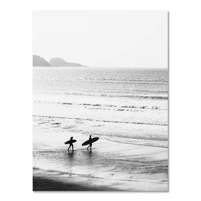 Black-and-white wall poster of two people standing and splashing in shoreline surf