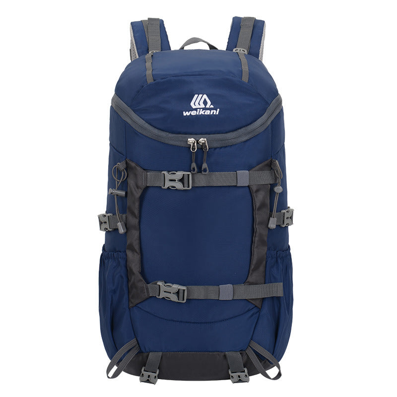 Dark blue hiking backpack with front zipper pocket and padded harness straps
