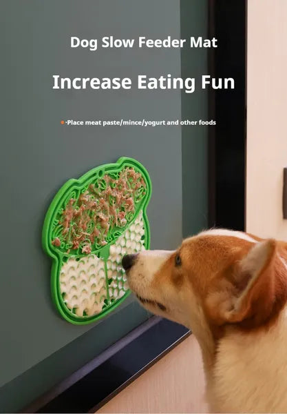 Slow feeder lick mat with suction base; green pad as a dog licks it.