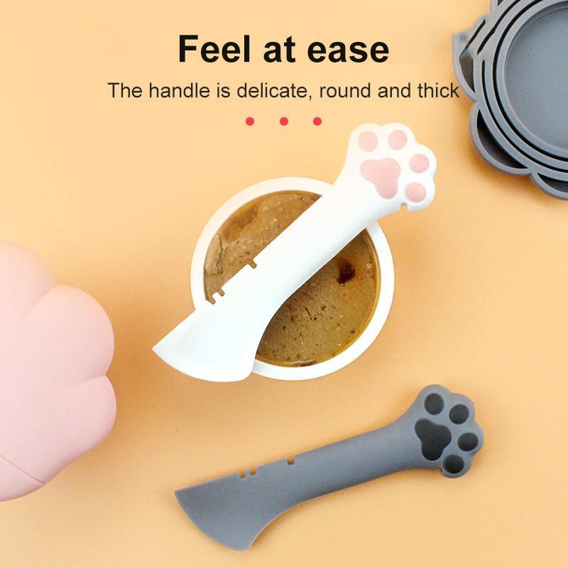 Pet food can spoon and lid opener with paw-shaped handle and gray lid opener