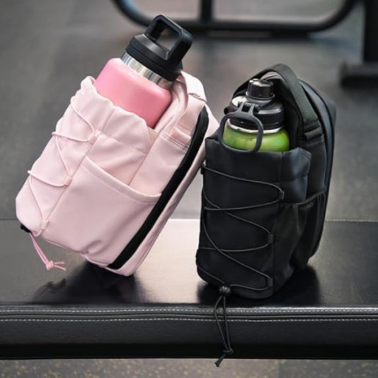 Pink and black fitness crossbody bag with bottle holder and front pocket straps