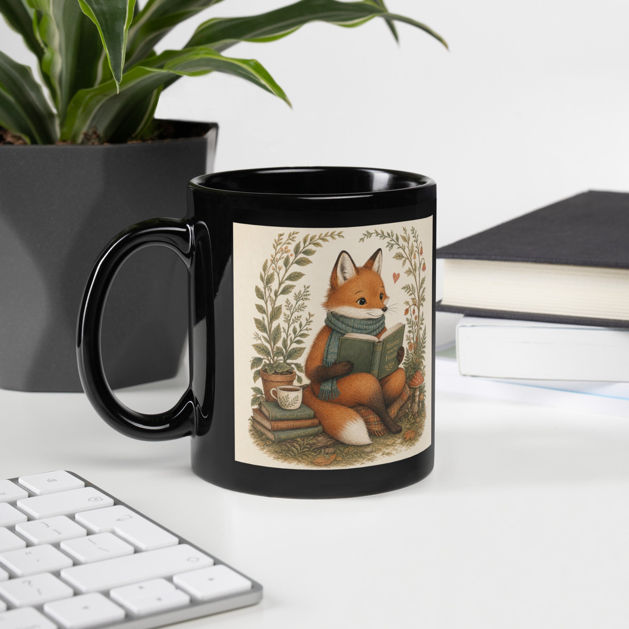 Black glossy mug with seated fox in woodland plants illustration on front.