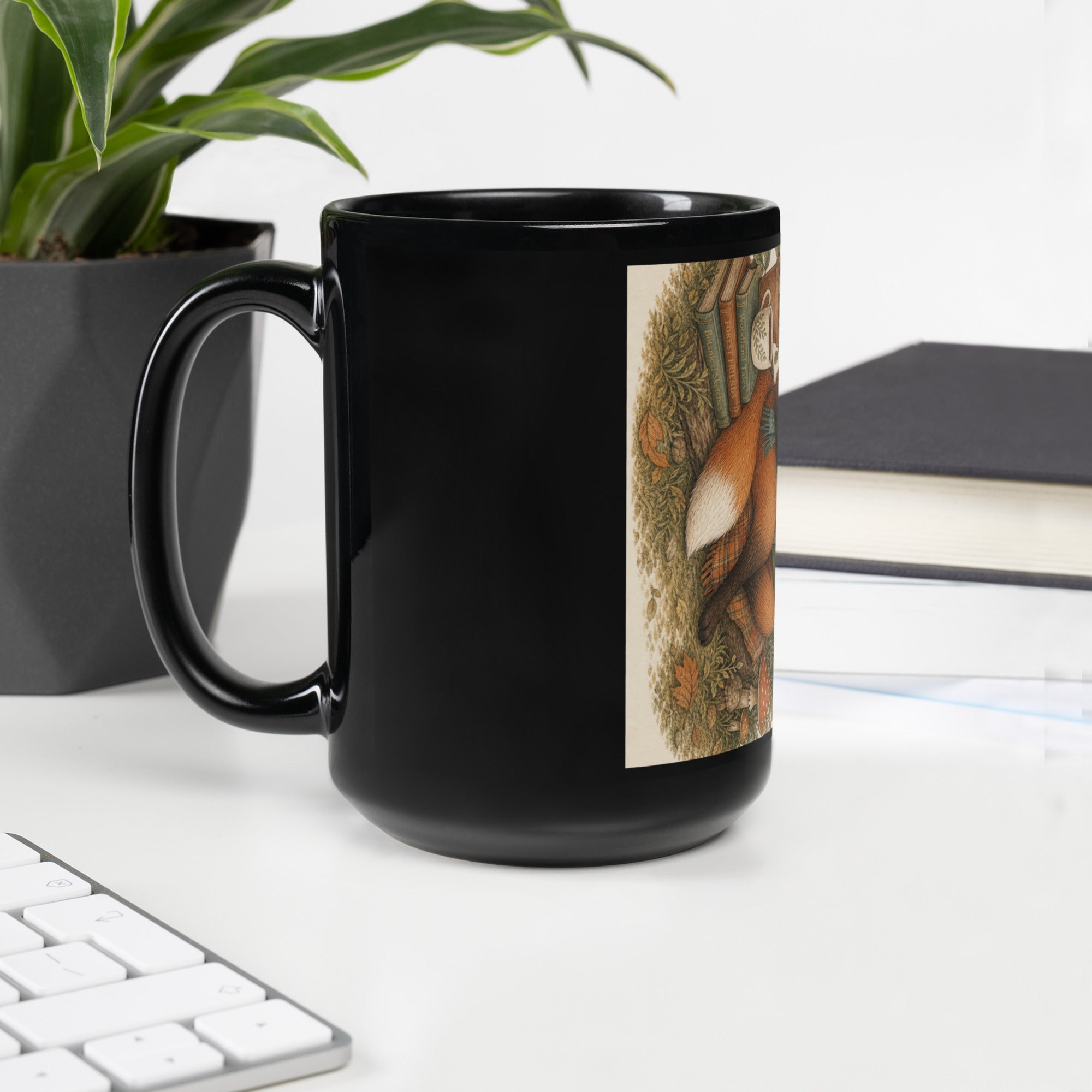 Black glossy mug with woodland fox illustration on front, curved side handle.