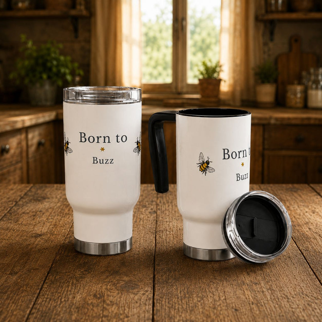 Two white travel mugs with black handles and bee graphics; one lid open