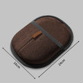 Dark brown deshedding grooming glove mitt with textured mesh and stitched strap