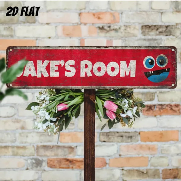 Aluminum decorative sign with “JAKE'S ROOM” and blue owl eyes on red metal