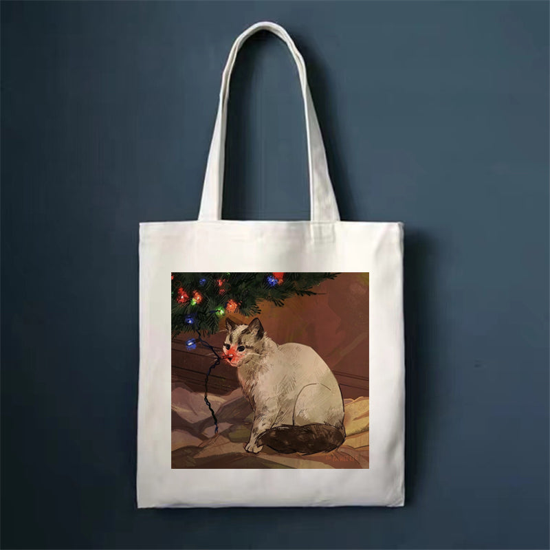 Canvas tote bag with cat illustration by string lights, square front print and long handles