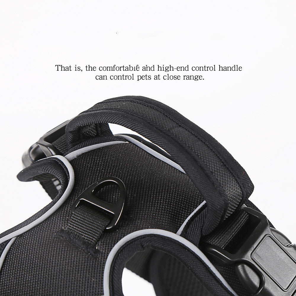 Black dog harness with padded handle, adjustable buckles, and reflective trim
