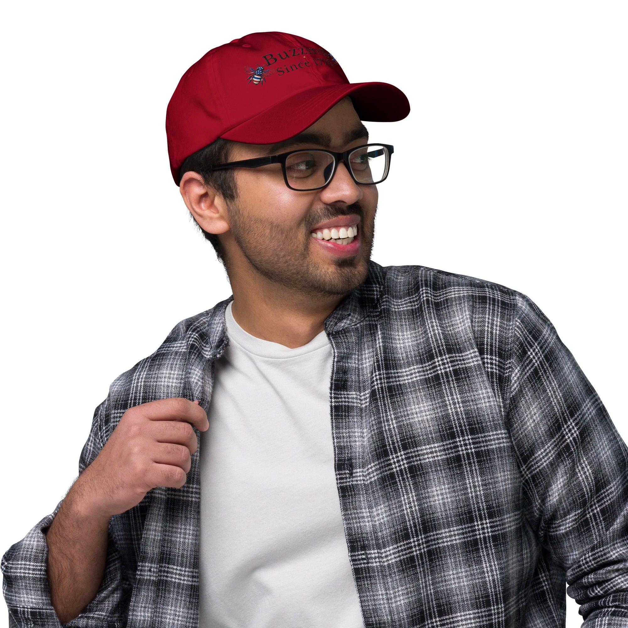 Cranberry red dad hat with embroidered bee and “Buzzing Since 1776” text