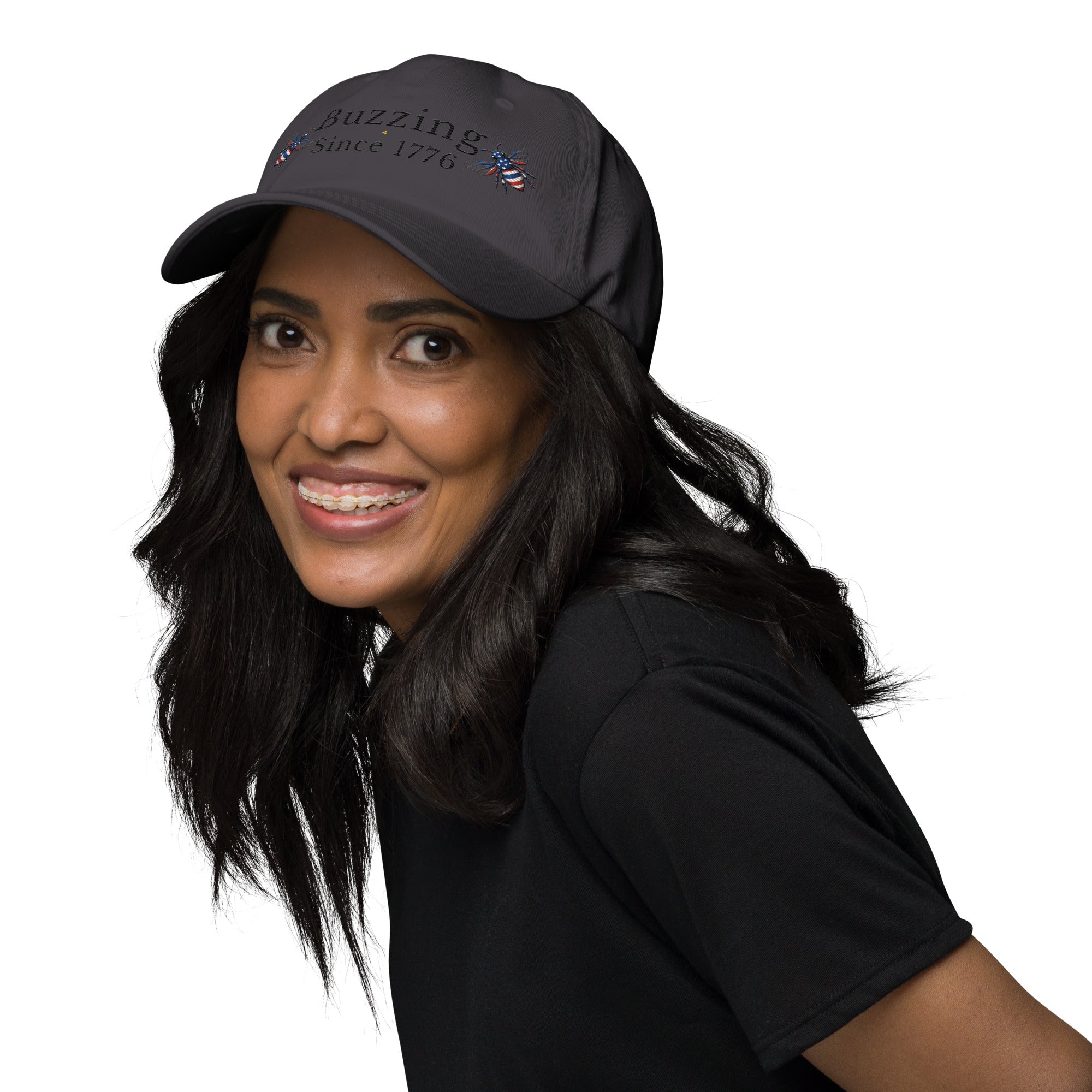 Dark gray dad hat with embroidered text and small bee patch on the front.