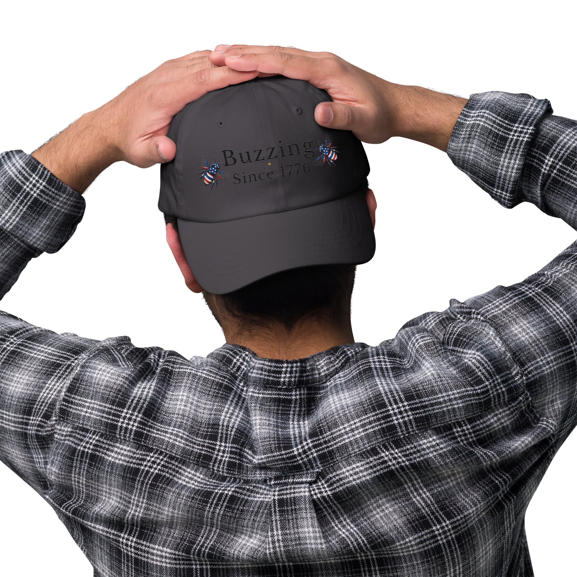 Dark gray dad hat with embroidered “Buzzing Since 1776” on front